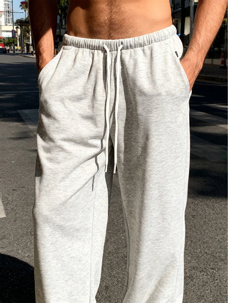 Men's Casual Jogging Pants - Straight-leg, loose fit loungewear pants solid coloelastic waistband and drawstring design